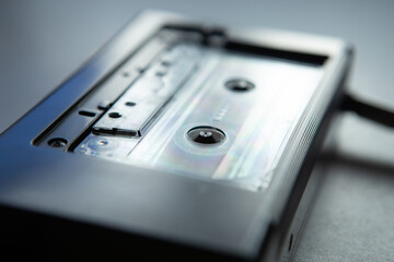 Fototapeta premium Music listening concept. Vintage cassette tape in audio player close-up