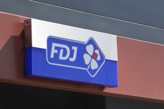 Saint-Priest, France - September 8, 2018: FDJ logo on a wall. Francaise des Jeux also called FDJ is the operator of national lottery games in France 