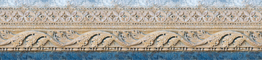 Aged roman frame of carved stone with geometric and foliage shape - seamless pattern