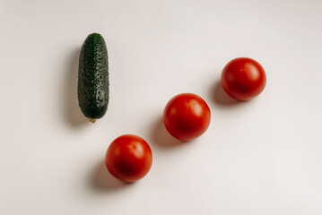 tomatoes and cucumbers on a white background