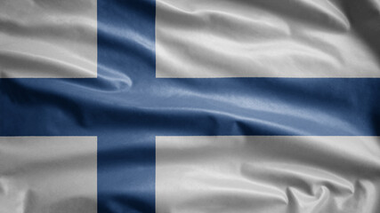 Finlandian flag waving in the wind. Close up of Finland banner blowing soft silk