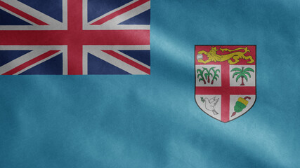 Fijian flag waving in the wind. Close up of Fiji banner blowing soft silk.