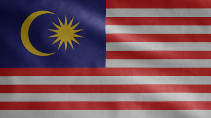 Malaysian flag waving in the wind. Close up of Malaysia banner blowing soft silk.