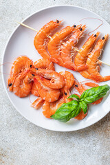 shrimp on skewer prawns kebabs seafood snack trend meal pescetarian diet vegetarian food copy space food background rustic. top view 