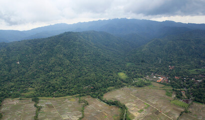 Aerial view of the green cliffs or hills of Menoreh extending from the west of Yogyakarta to Purworejo, Central Java. 