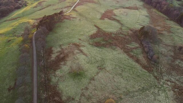 Low Level Aerial Footage Over The Field At Mugdock Park Near Glasgow Where The Battle Scene For The Movie Outlaw King Was Filmed. The Copse Of Trees To The Left Are Particularly Noticeable.