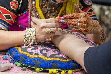 Henna drawing on hands, hands painted with henna, henna tattoo, close up