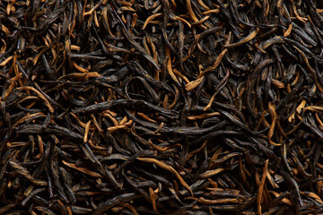 Black tea texture as a background.
