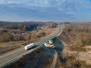 Aerial Top View of White Truck with Cargo Semi Trailer Moving on