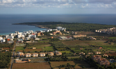 Cala Millor with its hotel resorts and Punta de n'Amer cape at the Mediterranean Sea coast, Mallorca in Spain