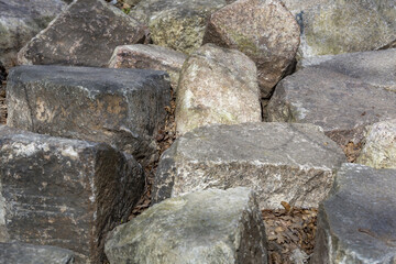 Untreated rough natural stone in everyday environment, gardening and landscaping