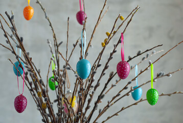 easter eggs on a gray background.colorful Easter eggs decorate the willow branches © fotofotofoto