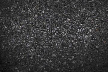 Fototapeta na wymiar Black stone background texture. Stone seeds. Black stone plaster cement. Grunge wall. Graphite. Absatract background.