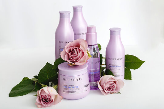 Hair cosmetics, hair shampoo, beauty products for beauty salon with flower on white background. L'oreal Professionnel serie expert. Women hair care set. Loreal Professionel