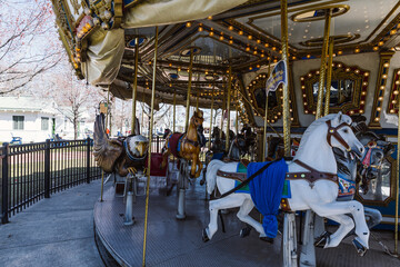 Fototapeta na wymiar An empty, colorful, old fashion carousel for kids in a park in Philadelphia
