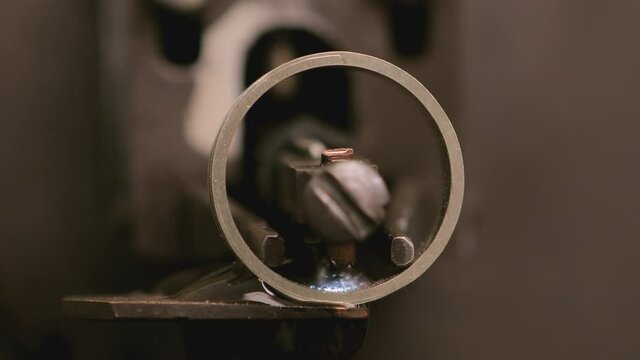 Close up shot of special machine for hallmarking jewelry , golden or silver ring . Process of probing , marking , creating precious ring . Jewellery industrial factory . 
