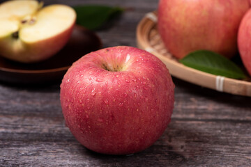 Ripe red apples on wooden table