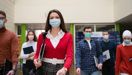 students group at university walking and wearing face mask