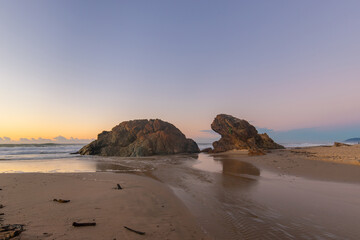 Fototapeta na wymiar Sunrise view of Watonga Rocks at Lighthouse Beach, Port Macquarie, Australia.