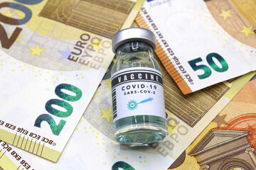 Vaccine vial on euro banknotes