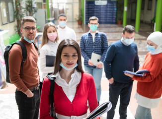 Portrait of multiethnic students group at university wearing protective face mask