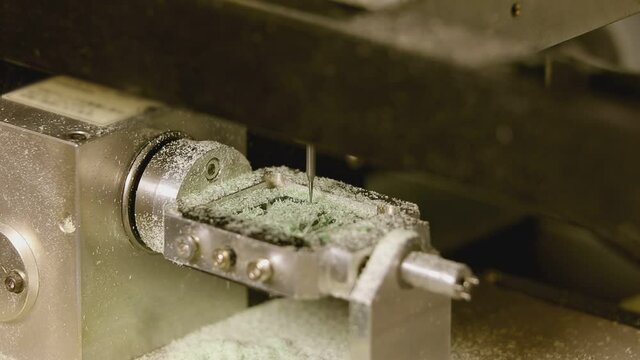 Close up shot of special machine with needle for hallmarking jewelry . Process of probing , marking , creating , designing precious ring . Jewellery industrial factory .  3d printing machine
