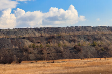 View of slag heaps of iron ore quarry. Mining industry