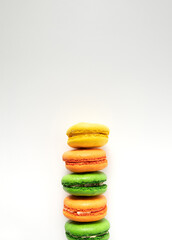 Colorful macarons on white background