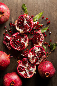 Pomegranates on Wood Background