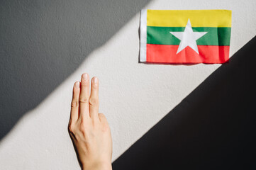 Protester showing three-finger salute to against the Myanmar military coup. This gesture becoming a symbol of resistance and solidarity for democracy movements across south-east Asia.