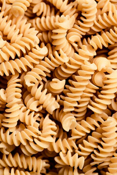 Macro shot of dried fusilli pasta.