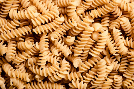 Macro shot of dried fusilli pasta.