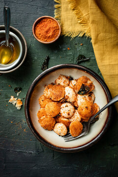 Breakfast  Mini-Idli served with ghee and powder.