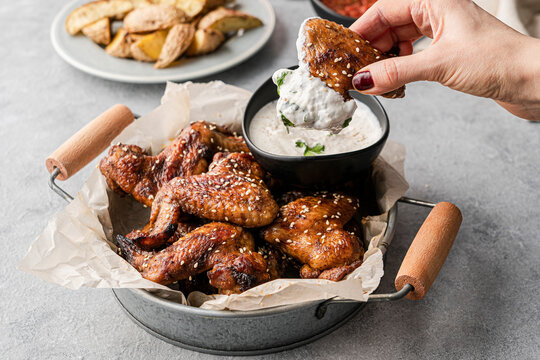 chicken wings with dips and potatoes