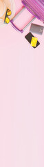 summer travel concept from credit card and suitcase with summer collection on pink background. web banner size.