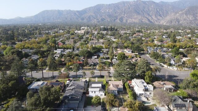 Aerial view above Pasadena neighborhood with mountain in the background. northeast of downtown Los Angeles, California, USA