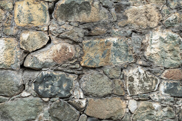 Backgrounds of the old fortress wall. Background of vintage stone wall