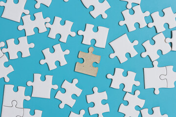  Jigsaw puzzle on blue background,contrast concept.