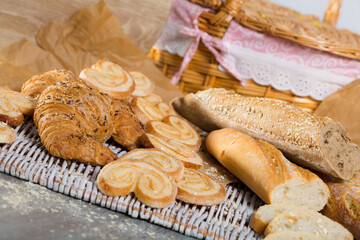 Image of various kinds of bread and bakery products on table