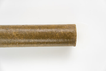 Dirty filter cartridge drinking water on a white background. Replacing cartridges is a mandatory...
