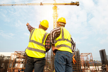 Construction team engineers speak to architects at construction sites or construction sites for high rise buildings, hospitals.