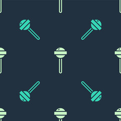 Green and beige Lollipop icon isolated seamless pattern on blue background. Food, delicious symbol. Vector