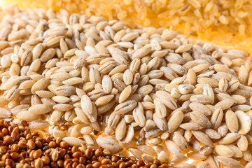 Heap of different cereals as background