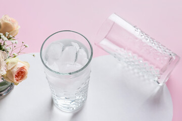 Creative composition with glasses of water on color background