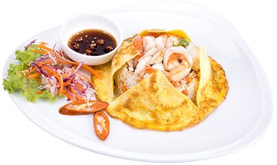 A view of a shrimp fried rice, in a restaurant or kitchen setting.