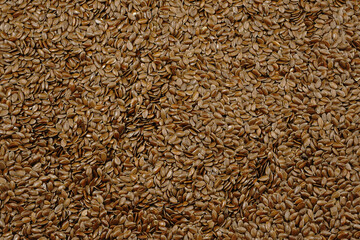 Flax seeds background. Raw dry linseed top view.
