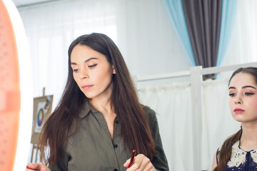 master does a beautiful blonde makeup in a beauty salon