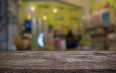 Empty wooden table in front of abstract blurred background of coffee shop . can be used for display or montage your products.Mock up for display of product