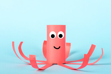 DIY and kids creativity. Eco-friendly reuse recycle from toilet roll tube. Children Paper Craft red...
