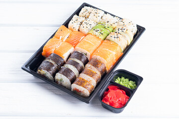 Sushi set in tray. Assorted types of sushi on tray. Detail of sushi set at restaurant